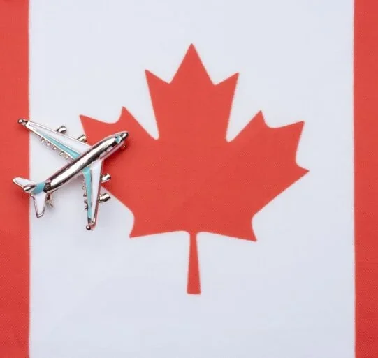 canada-flag-and-the-plane-the-concept-of-travel-free-photo-768x513